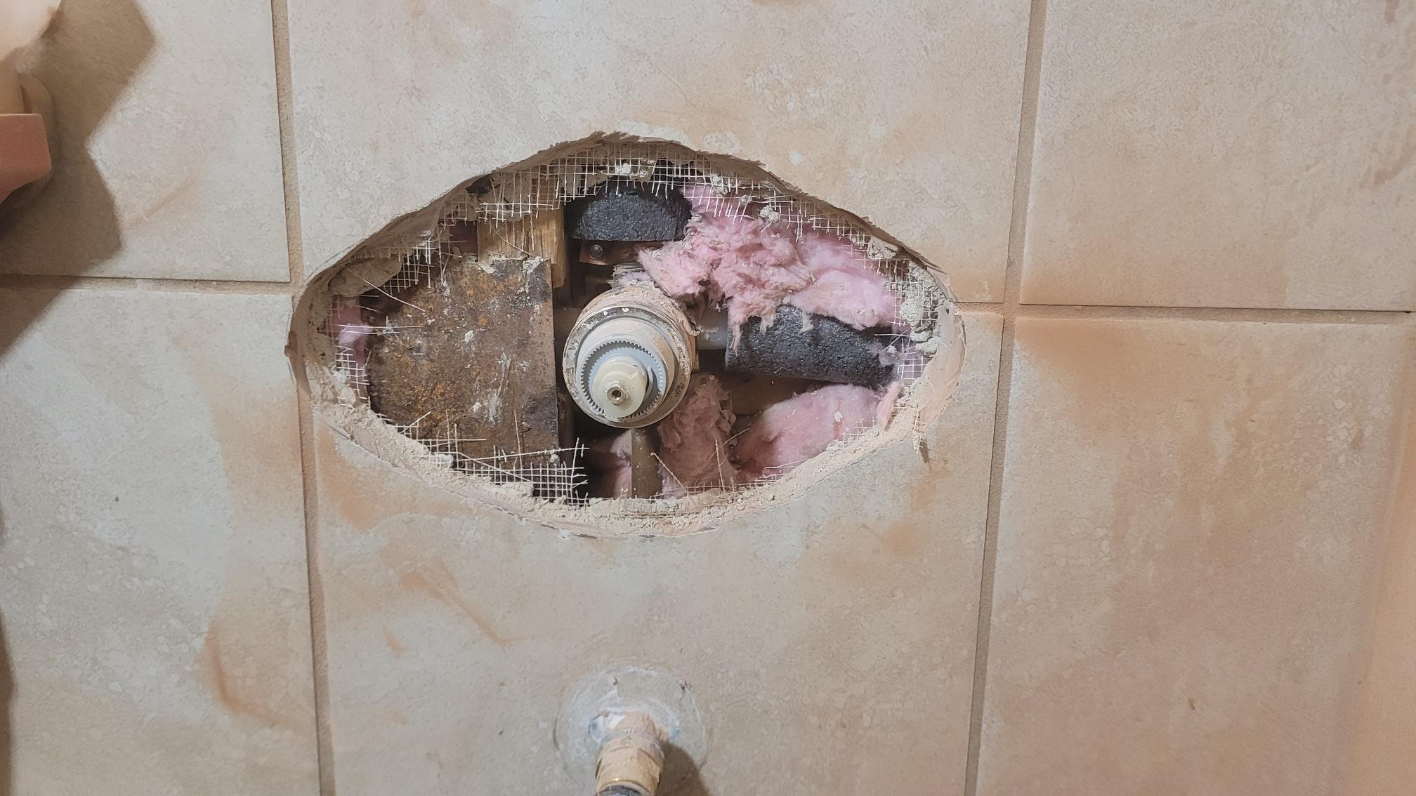 Corroded shower valve opened up for replacement in an Austin home