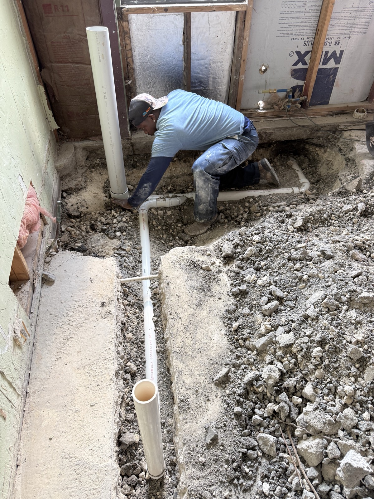 Rooter-Man of Austin plumber laying new drain lines beneath a slab foundation